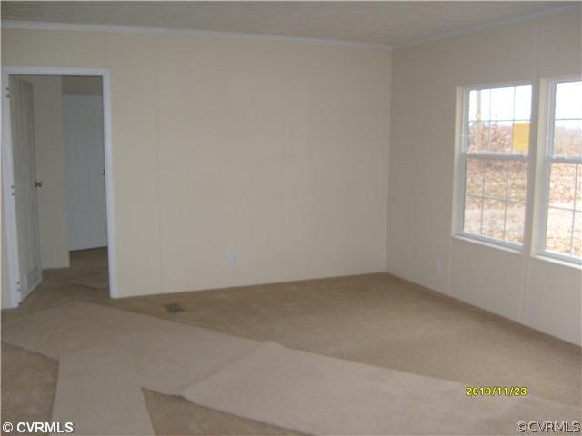 3430 Andersonville Road Dillwyn, VA 23936 - Photo 4 of 12 an empty room with windows