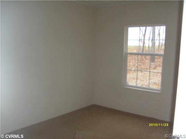 3430 Andersonville Road Dillwyn, VA 23936 - Photo 6 of 12 an empty room with a window