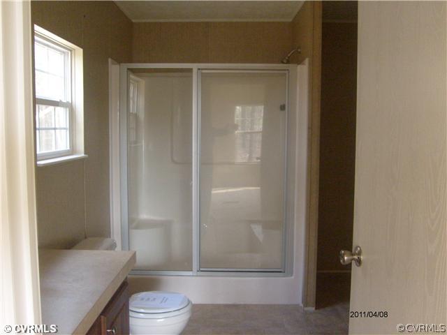 3430 Andersonville Road Dillwyn, VA 23936 - Photo 8 of 12 a bathroom with a granite countertop bathtub shower