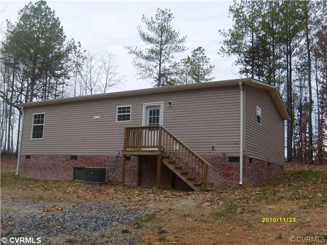 3430 Andersonville Road Dillwyn, VA 23936 - Photo 10 of 12 a view of a house with a yard and wooden fence