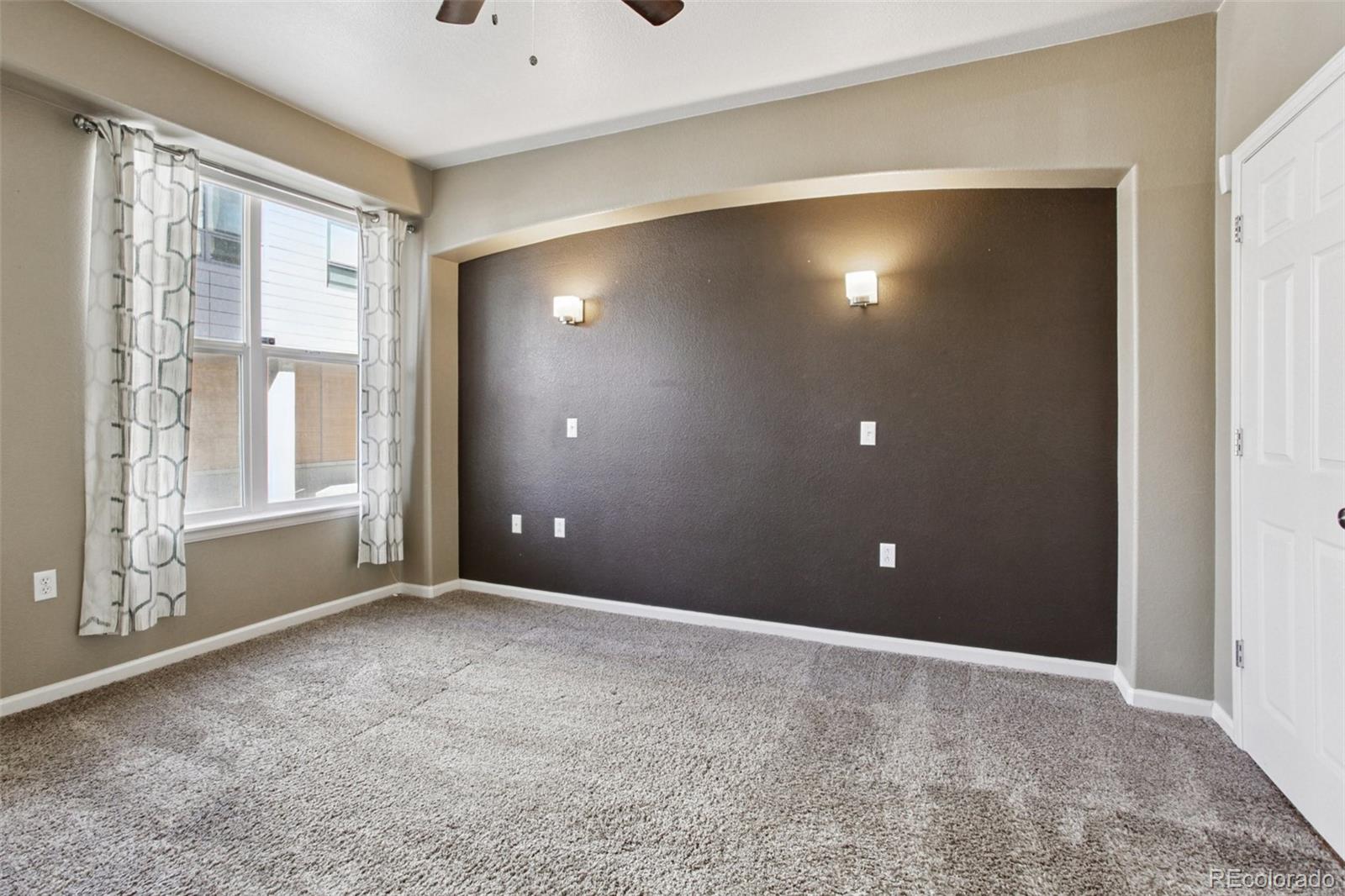 1747 Pearl Street, Unit 106 Denver, CO 80203 - Photo 14 of 26 a view of an empty room with a window
