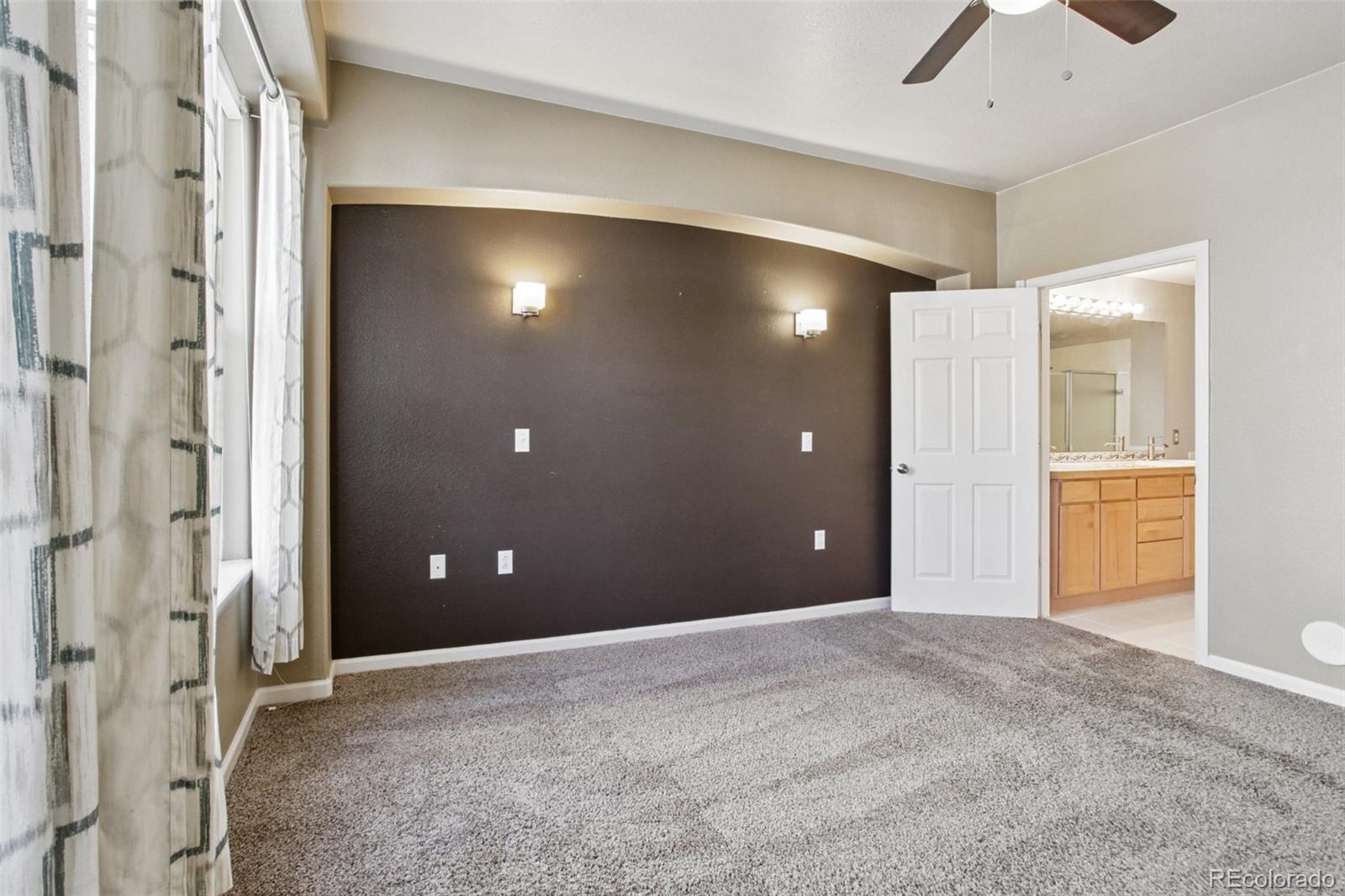 1747 Pearl Street, Unit 106 Denver, CO 80203 - Photo 15 of 26 a view of a livingroom with a chandelier fan and windows