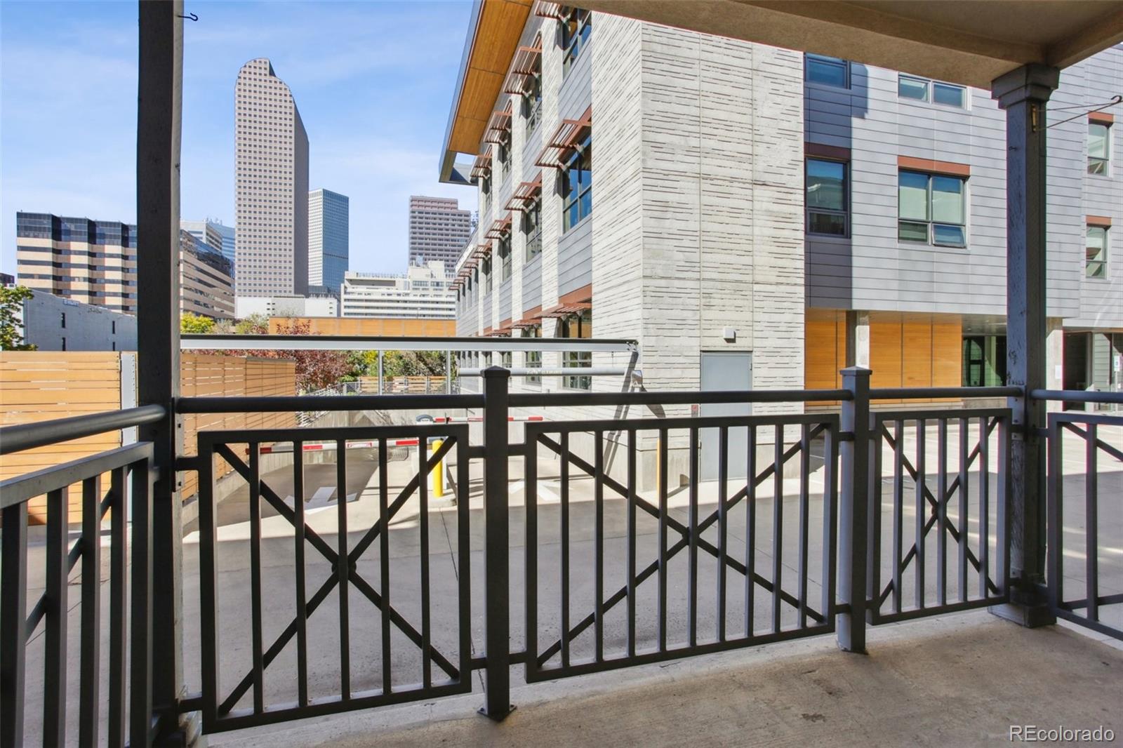 1747 Pearl Street, Unit 106 Denver, CO 80203 - Photo 22 of 26 a view of a balcony with furniture