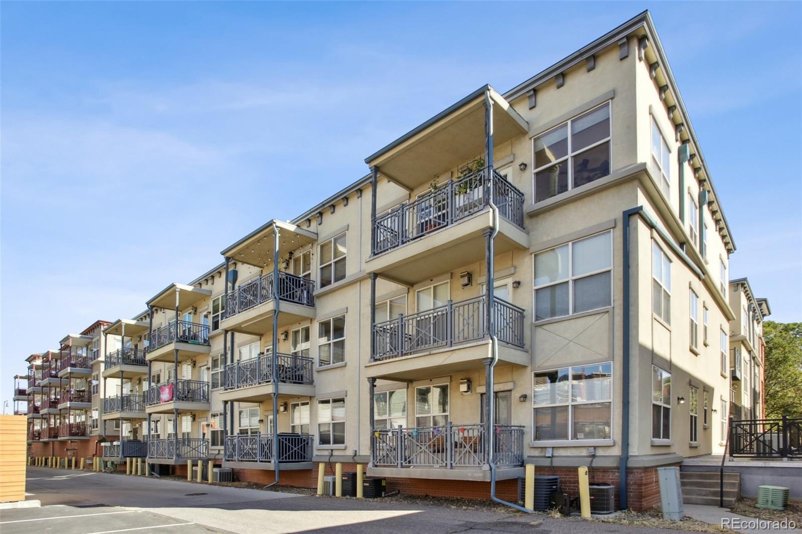 1747 Pearl Street, Unit 106 Denver, CO 80203 - Photo 25 of 26 a view of a building with a street