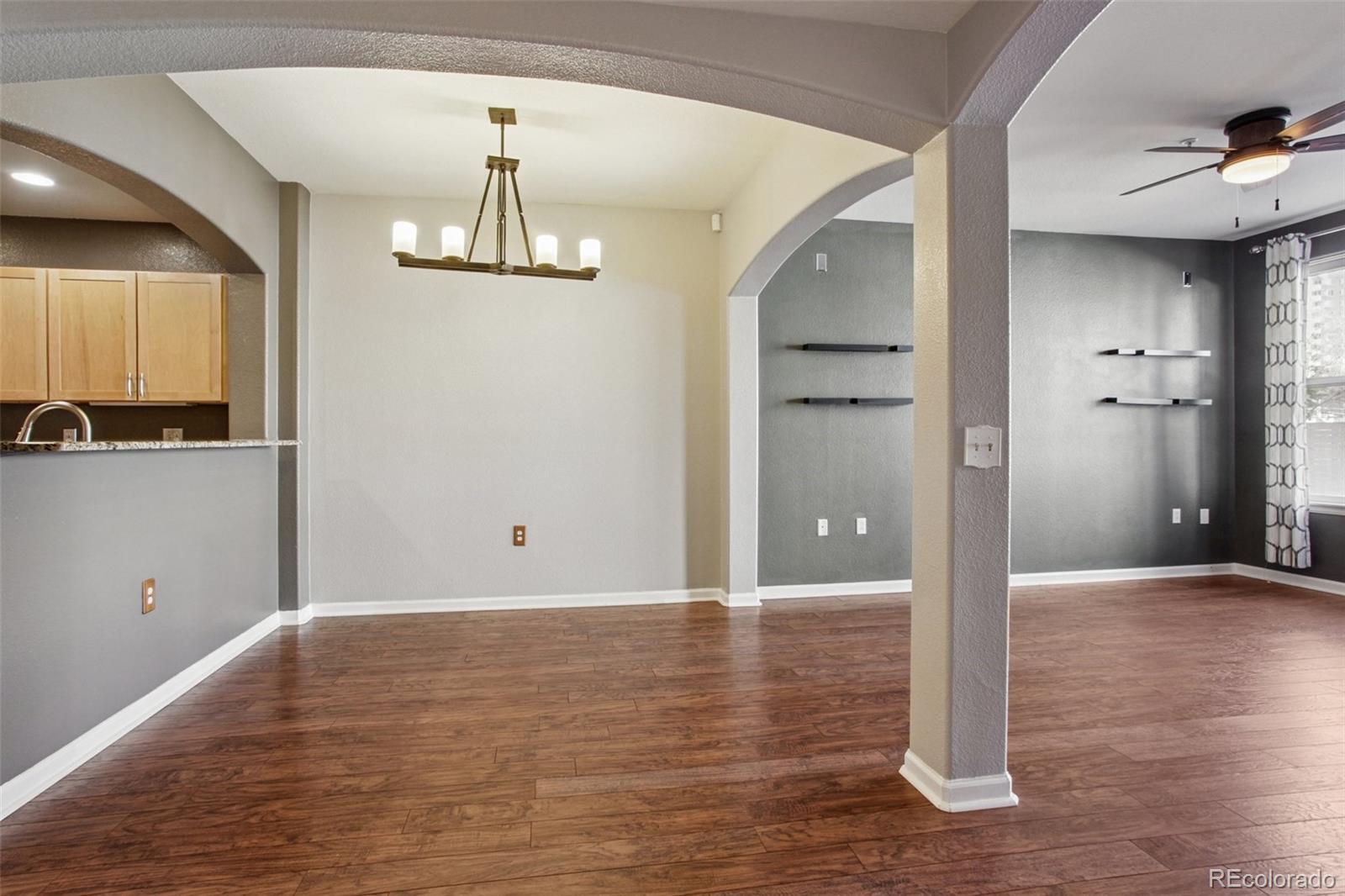 1747 Pearl Street, Unit 106 Denver, CO 80203 - Photo 9 of 26 a view of a kitchen with wooden floor and a sink