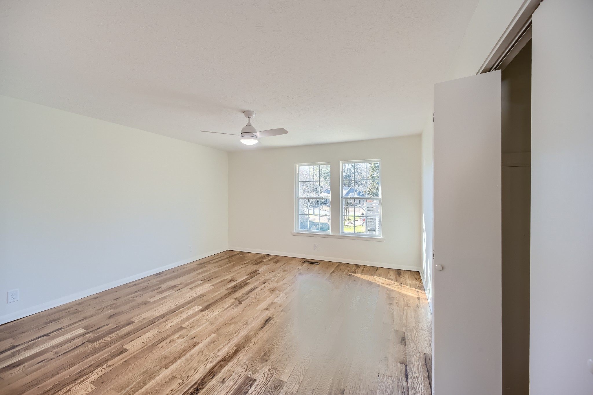 417 Hill Road Nashville, TN 37027 - Photo 11 of 27 wooden floor in an empty room with a window