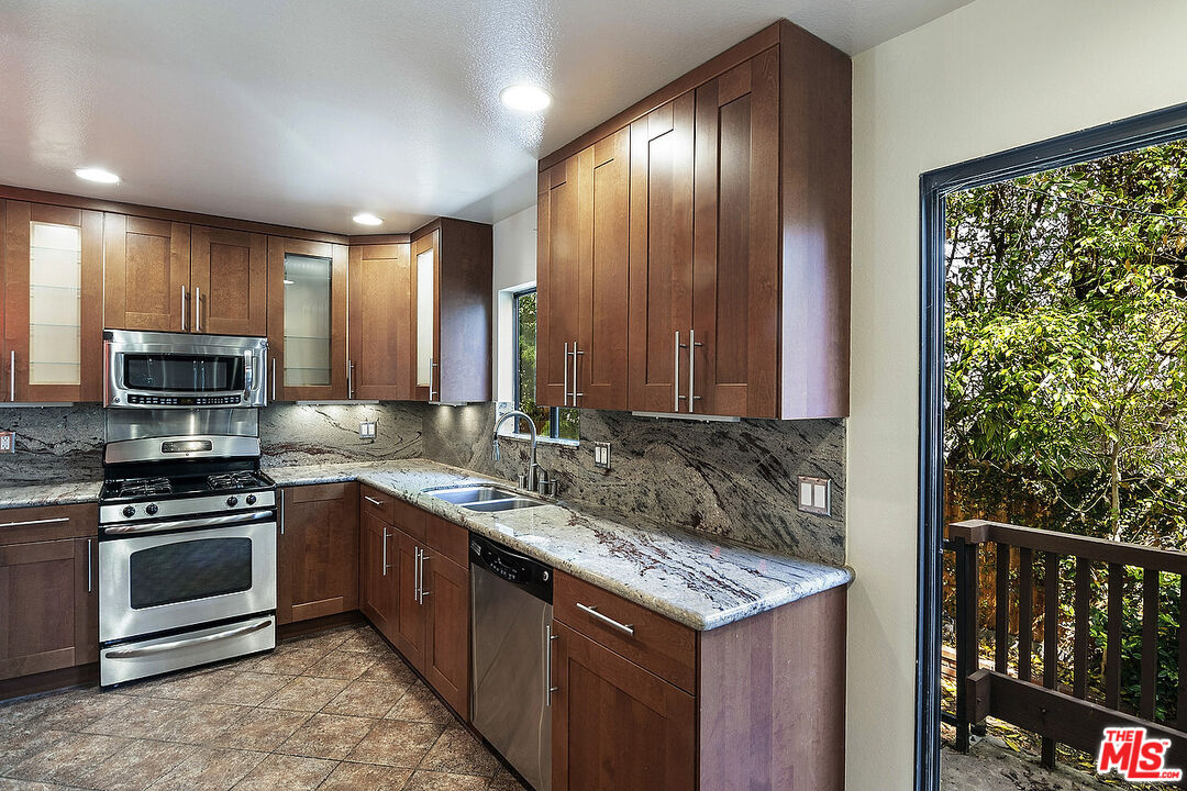 2216 South Bentley Avenue, Unit 10 Los Angeles, CA 90064 - Photo 12 of 40 a kitchen with a sink stove and microwave