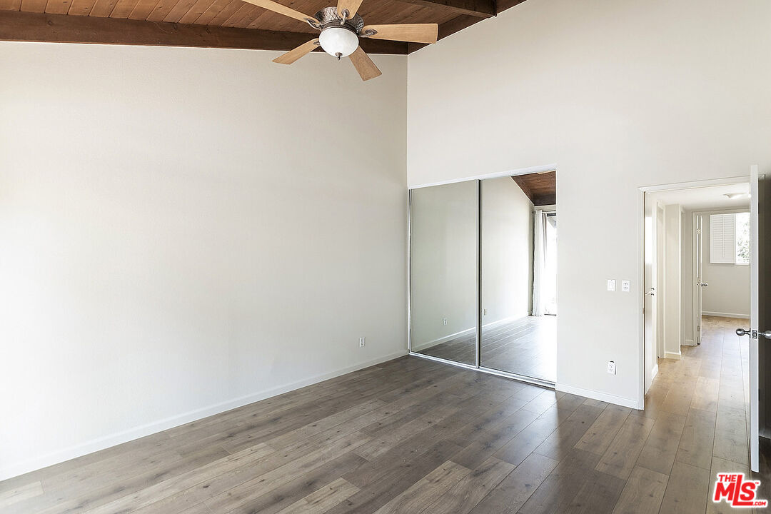 2216 South Bentley Avenue, Unit 10 Los Angeles, CA 90064 - Photo 20 of 40 a view of an empty room with wooden floor