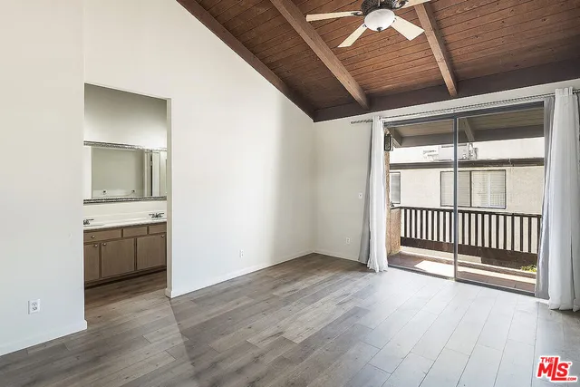 a view of a hallway with a kitchen