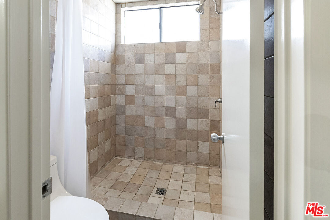 2216 South Bentley Avenue, Unit 10 Los Angeles, CA 90064 - Photo 24 of 40 a bathroom with a shower