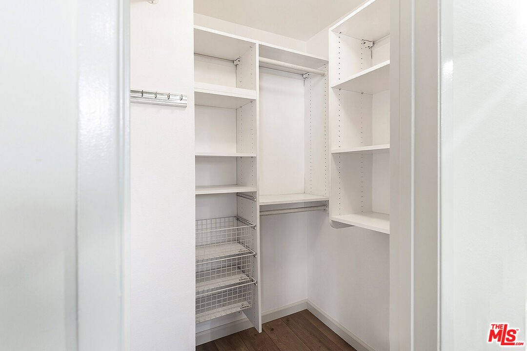 2216 South Bentley Avenue, Unit 10 Los Angeles, CA 90064 - Photo 25 of 40 a view of walk in closet with empty racks