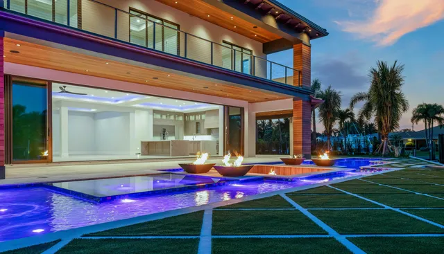 an aerial view of a house with a lake view