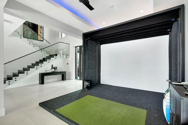 a spacious bedroom with a large bed and a large window