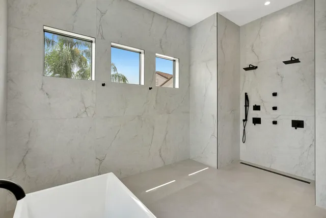 a view of swimming pool with seating space