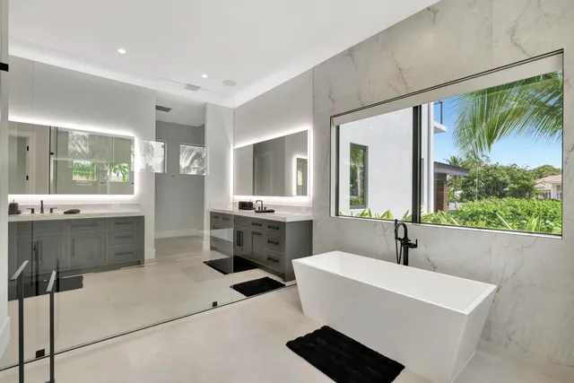 a view of a house with swimming pool and sitting area