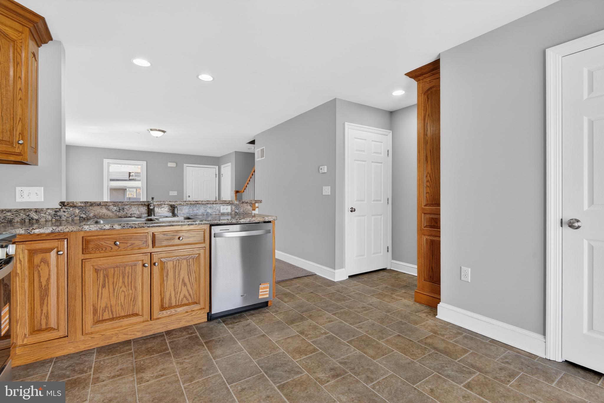 637 East Fulton Street Lancaster, PA 17602 - Photo 12 of 28 a large bathroom with a granite countertop sink and a mirror