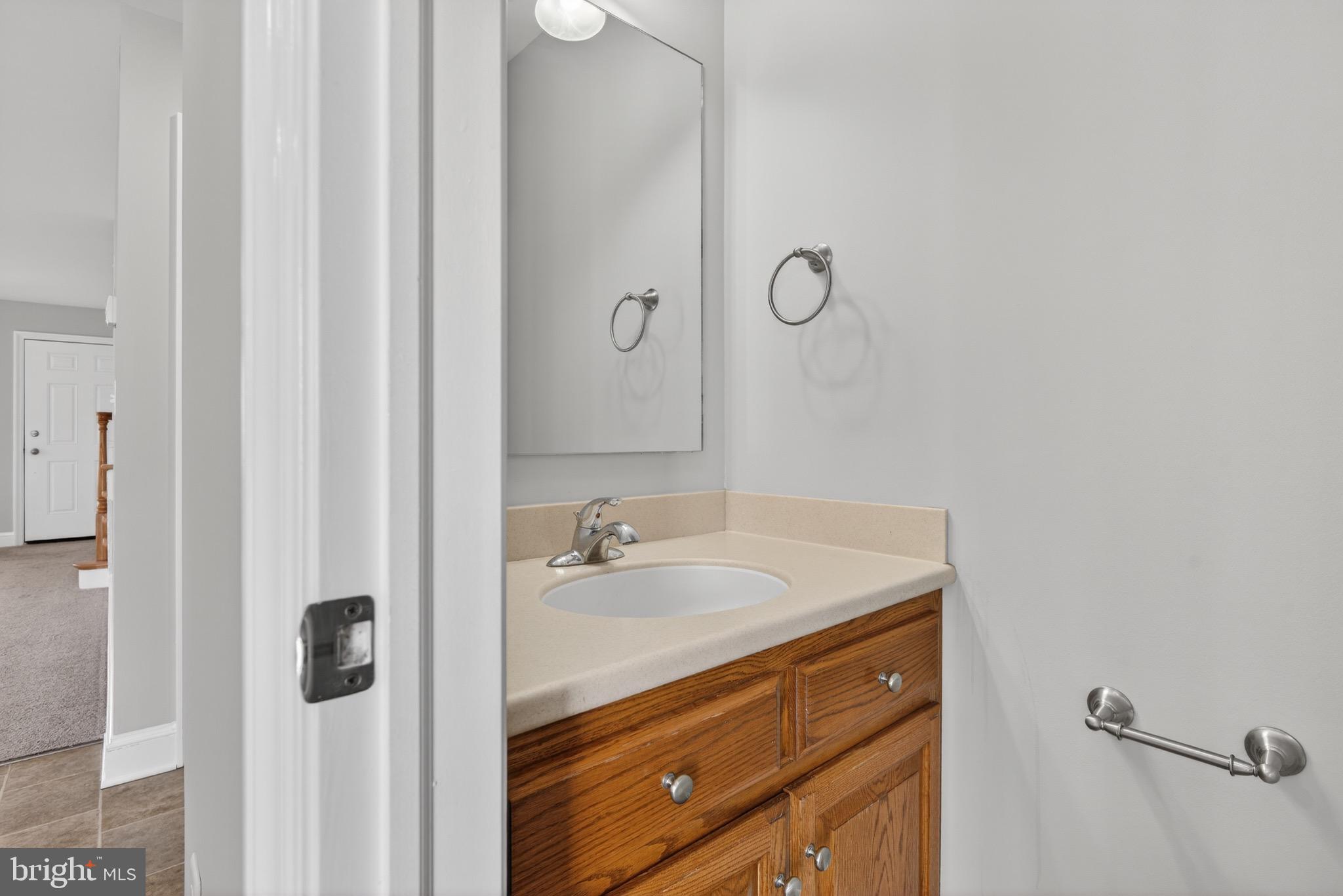 637 East Fulton Street Lancaster, PA 17602 - Photo 13 of 28 a bathroom with a sink and mirror