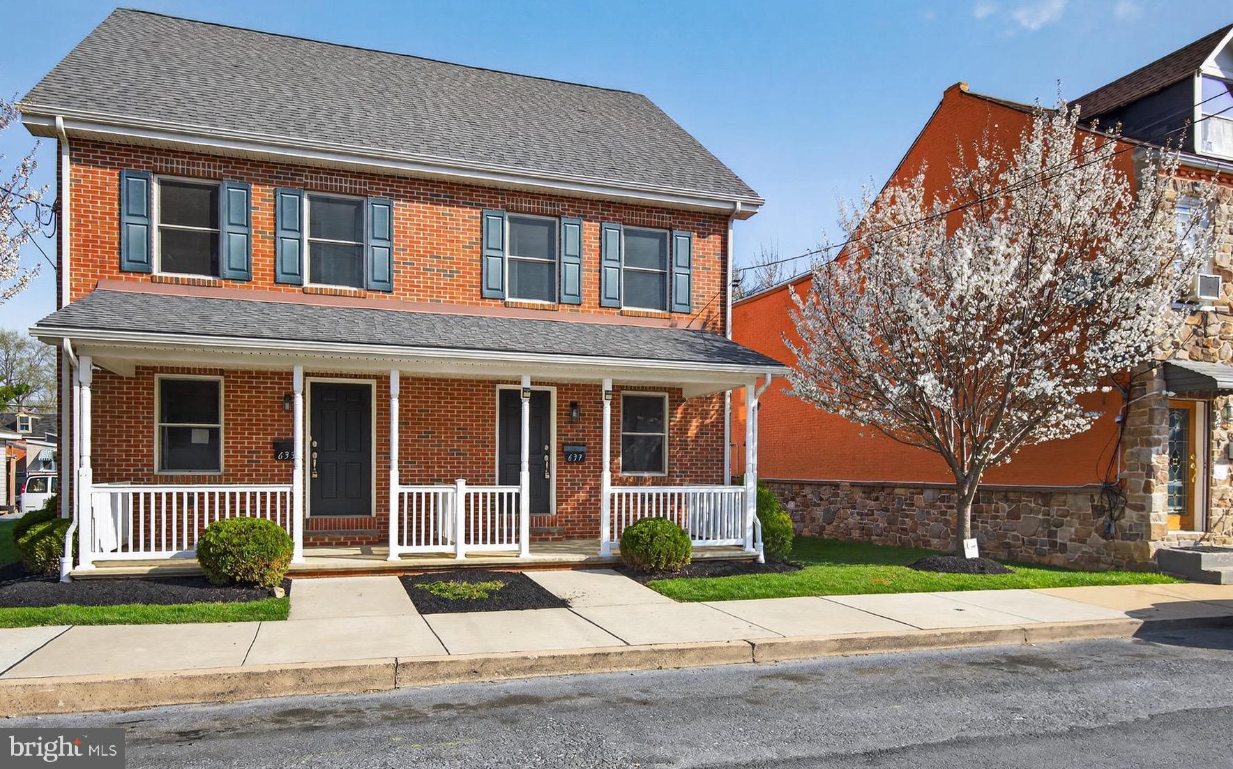 637 East Fulton Street Lancaster, PA 17602 - Photo 2 of 28 front view of house with a yard