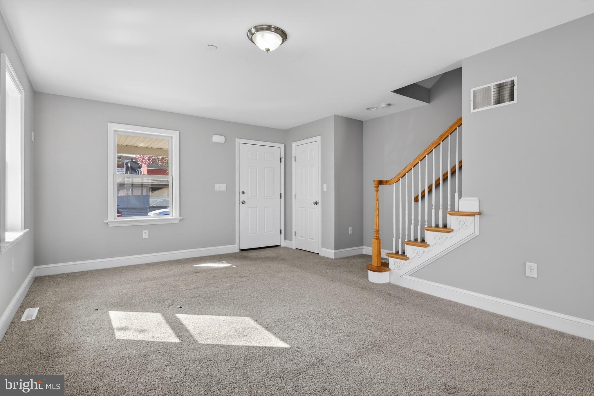 637 East Fulton Street Lancaster, PA 17602 - Photo 5 of 28 a view of an empty room with stairs