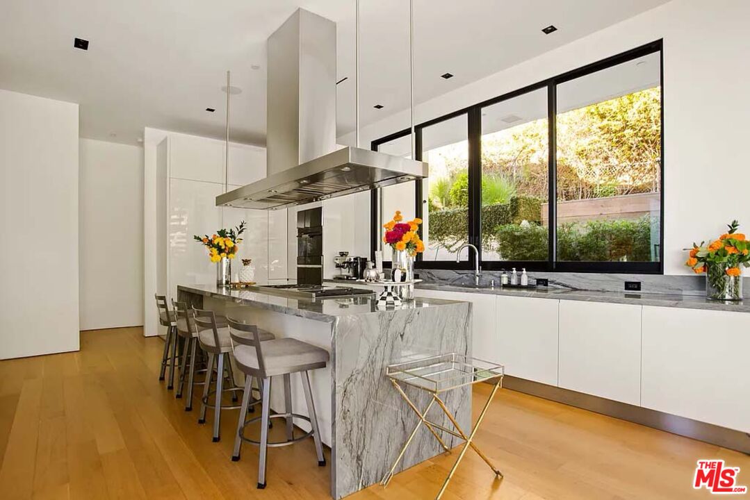 1331 Belfast Drive Los Angeles, CA 90069 - Photo 12 of 25 a view of a kitchen with kitchen island and a large window