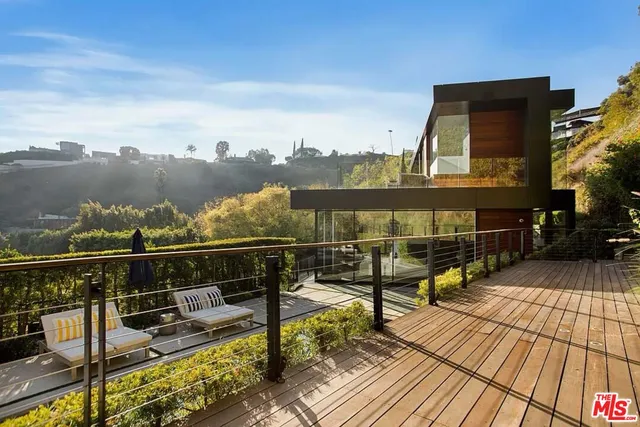 a view of roof deck with patio