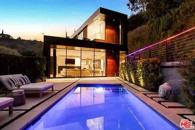 a view of swimming pool with patio