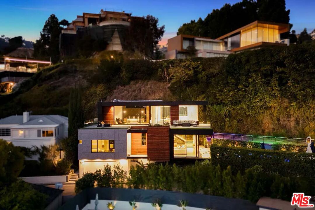 1331 Belfast Drive Los Angeles, CA 90069 - Photo 3 of 25 a front view of a house with a yard