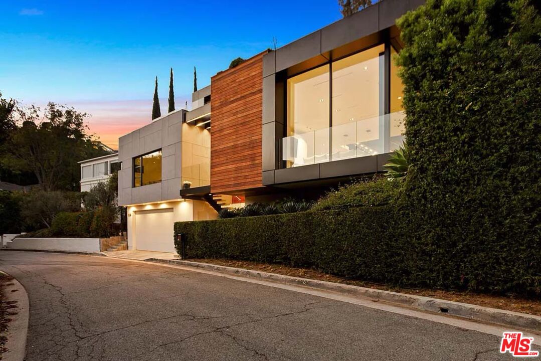 1331 Belfast Drive Los Angeles, CA 90069 - Photo 6 of 25 a front view of a house with a yard