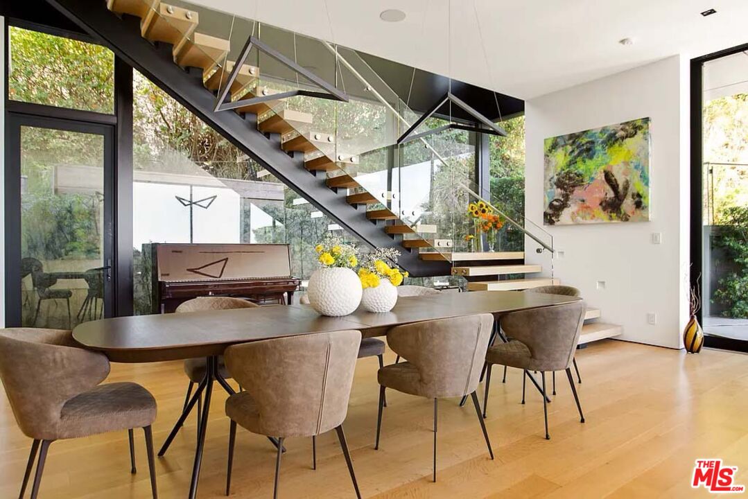 1331 Belfast Drive Los Angeles, CA 90069 - Photo 7 of 25 a dining room with furniture and wooden floor