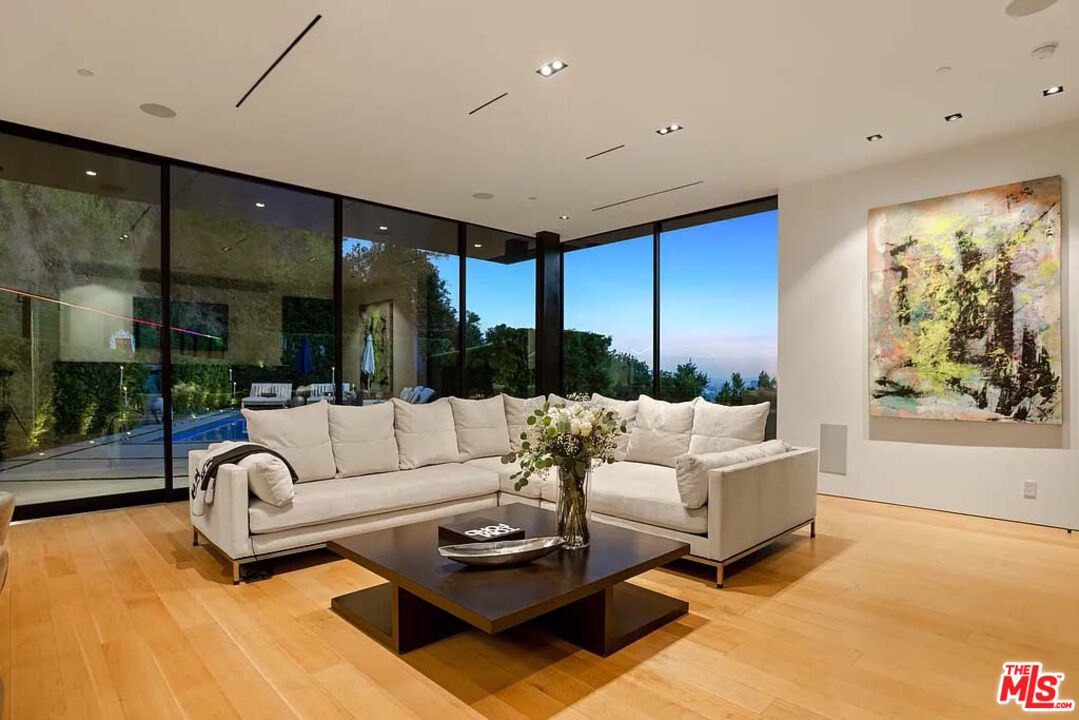 1331 Belfast Drive Los Angeles, CA 90069 - Photo 8 of 25 a living room with furniture and a large window