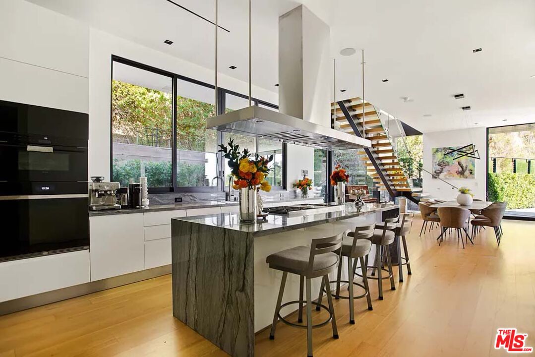 1331 Belfast Drive Los Angeles, CA 90069 - Photo 9 of 25 a view of a dining room with furniture window and outside view