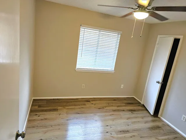 a view of balcony with wooden floor