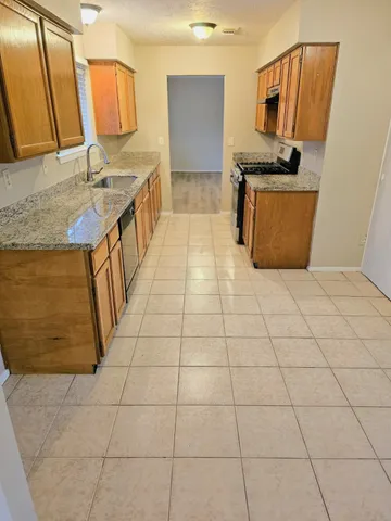 a bathroom with a sink a mirror and a bathtub