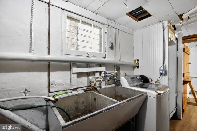 a kitchen with a sink cabinets and window