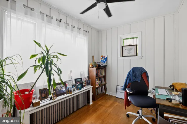 a workspace with furniture and wooden floor