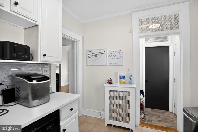 a kitchen with a stove and a refrigerator