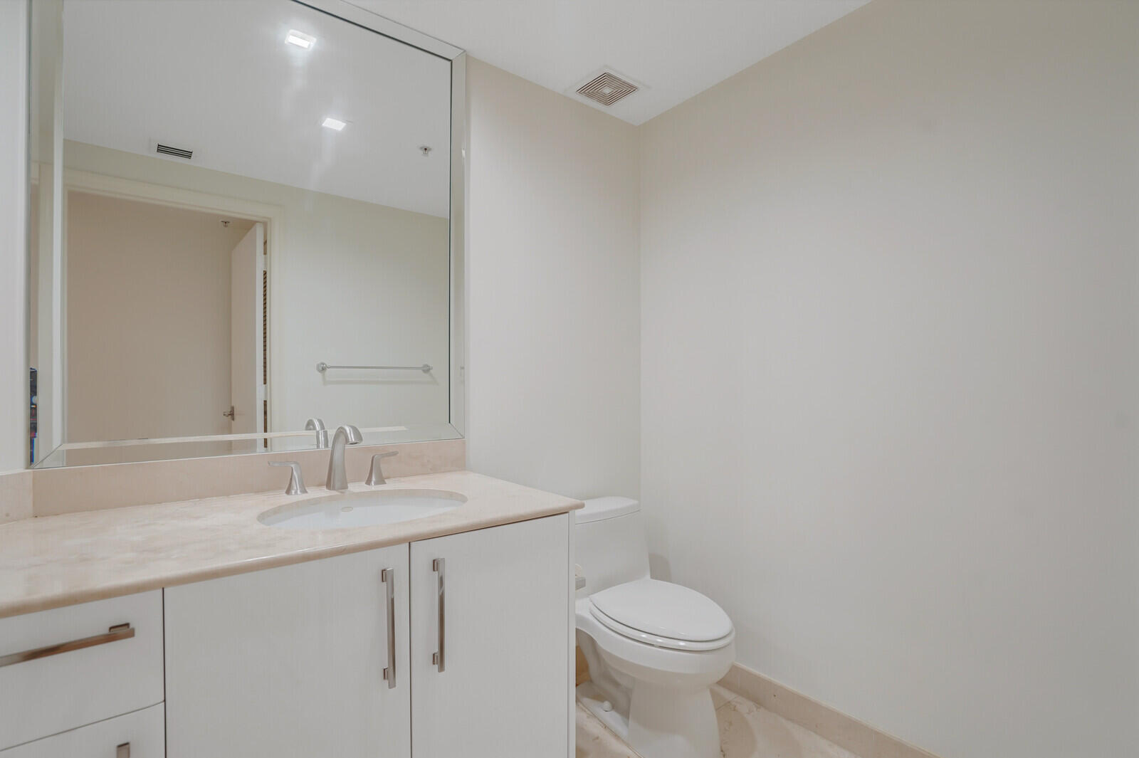 2051 Southeast 3rd Street, Unit TH7 Deerfield Beach, FL 33441 - Photo 17 of 48 a bathroom with a sink a toilet and a mirror