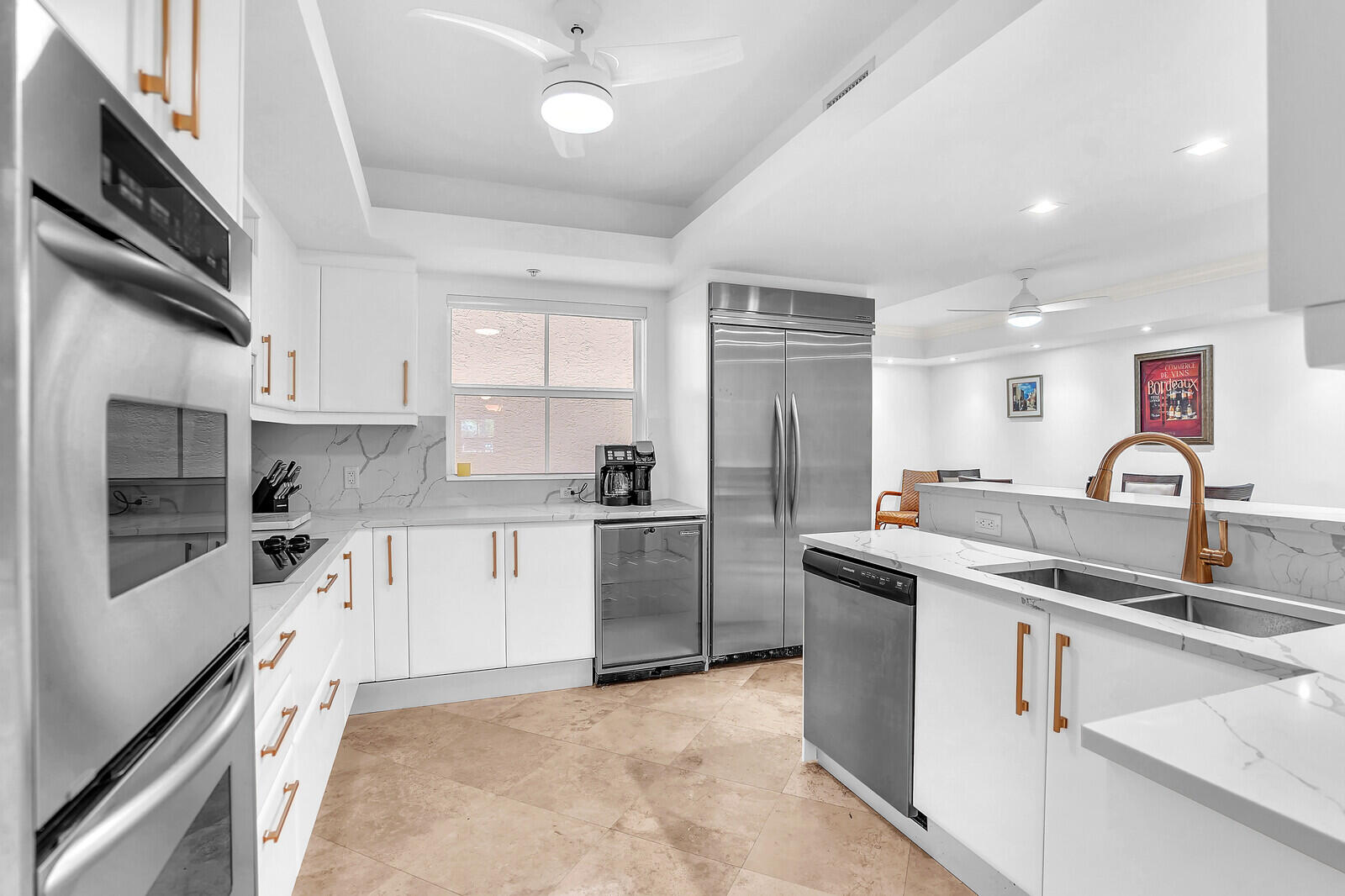 2051 Southeast 3rd Street, Unit TH7 Deerfield Beach, FL 33441 - Photo 20 of 48 a kitchen with a sink cabinets and stainless steel appliances