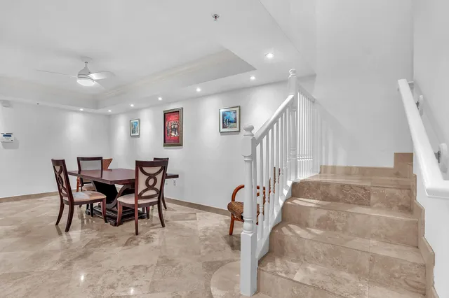 a spacious bedroom with a bed and a dresser