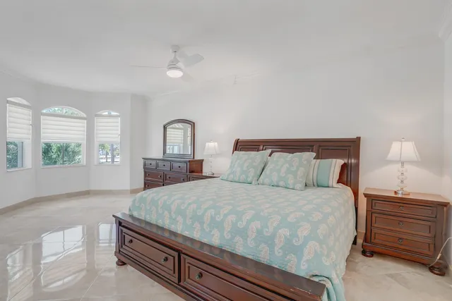 a bedroom with furniture and a window