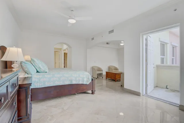 a bedroom with a bed and a table in it