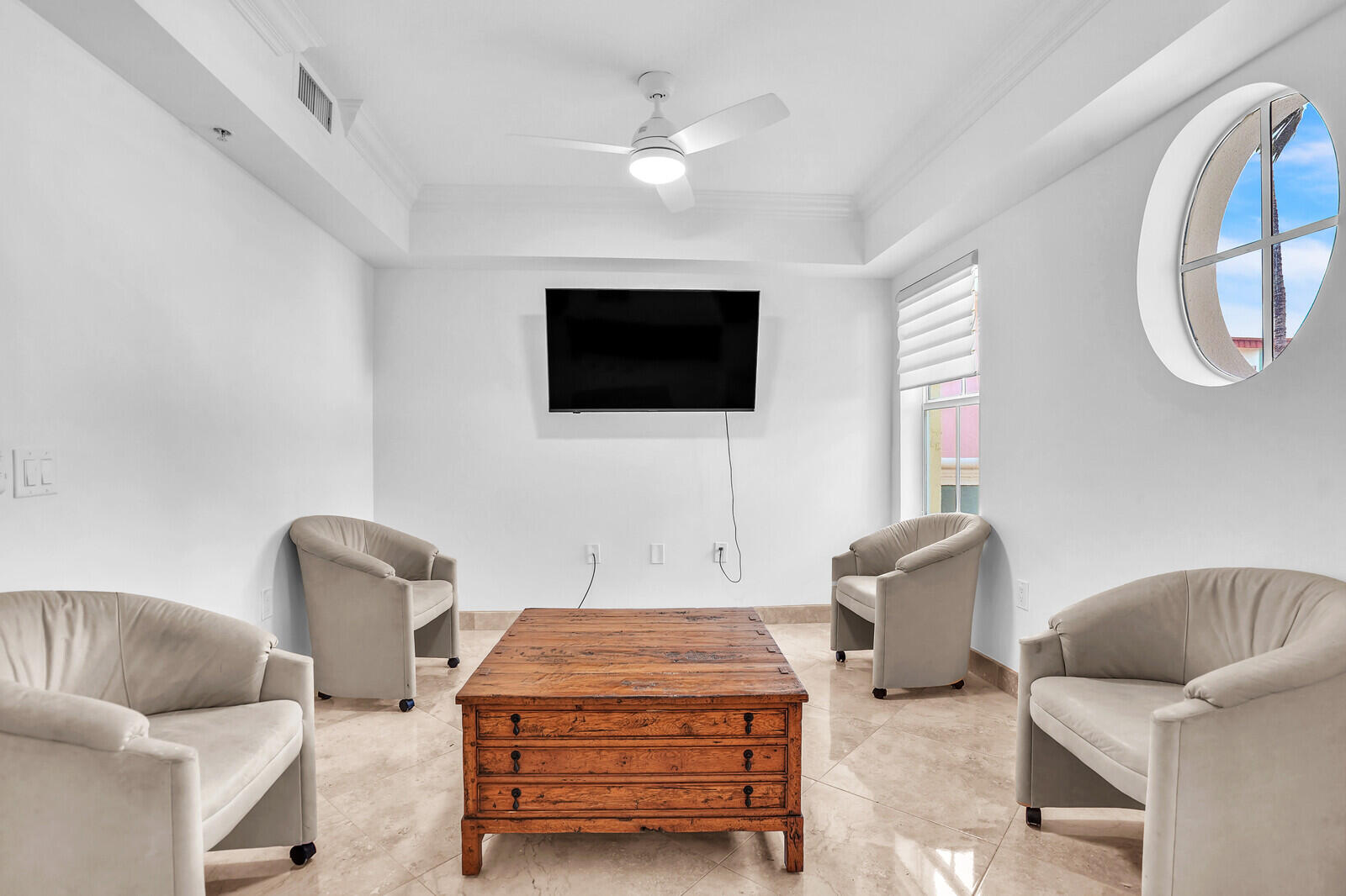 2051 Southeast 3rd Street, Unit TH7 Deerfield Beach, FL 33441 - Photo 31 of 48 a living room with furniture and a flat screen tv