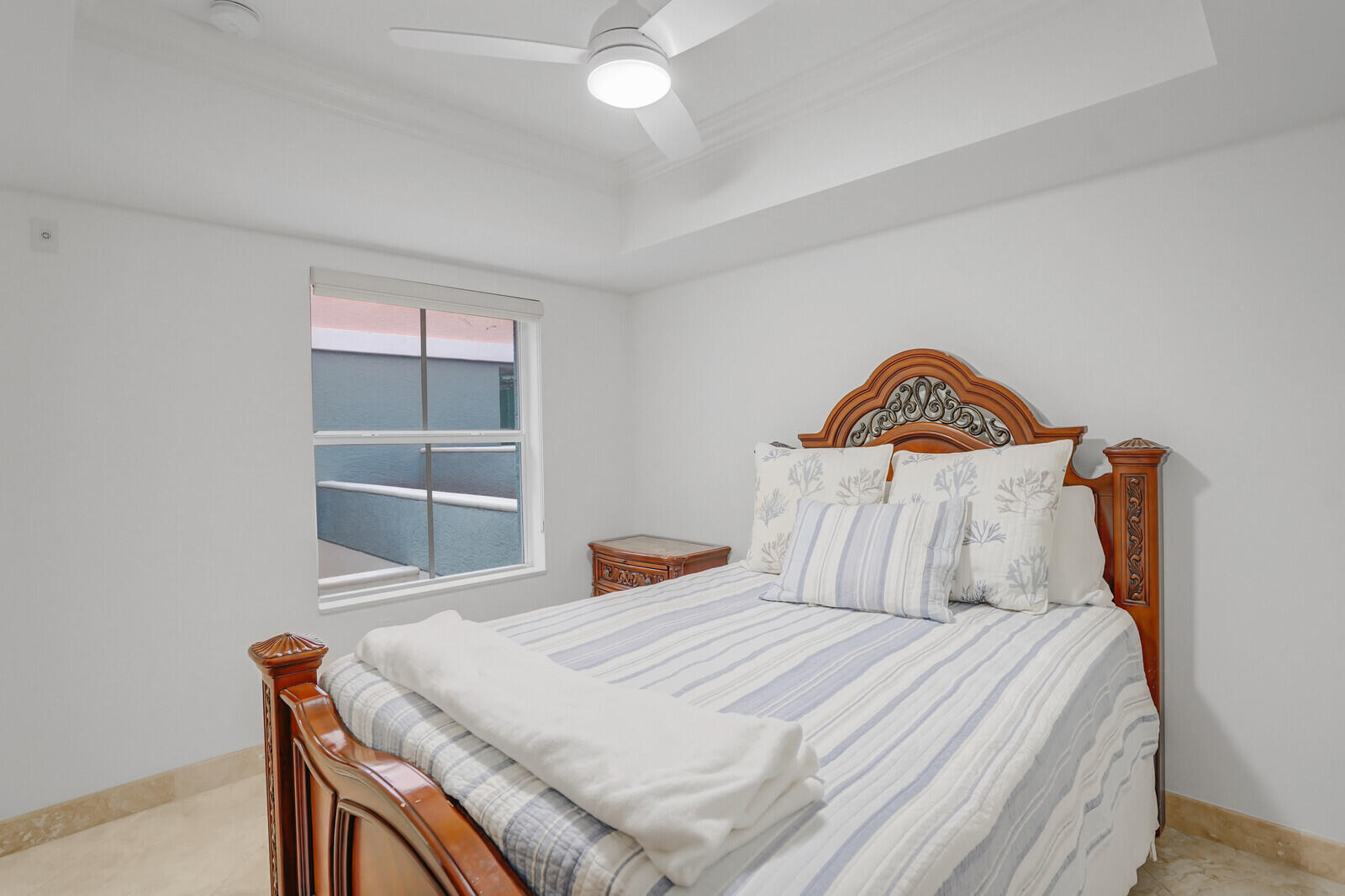 2051 Southeast 3rd Street, Unit TH7 Deerfield Beach, FL 33441 - Photo 33 of 48 a bedroom with a bed and a window