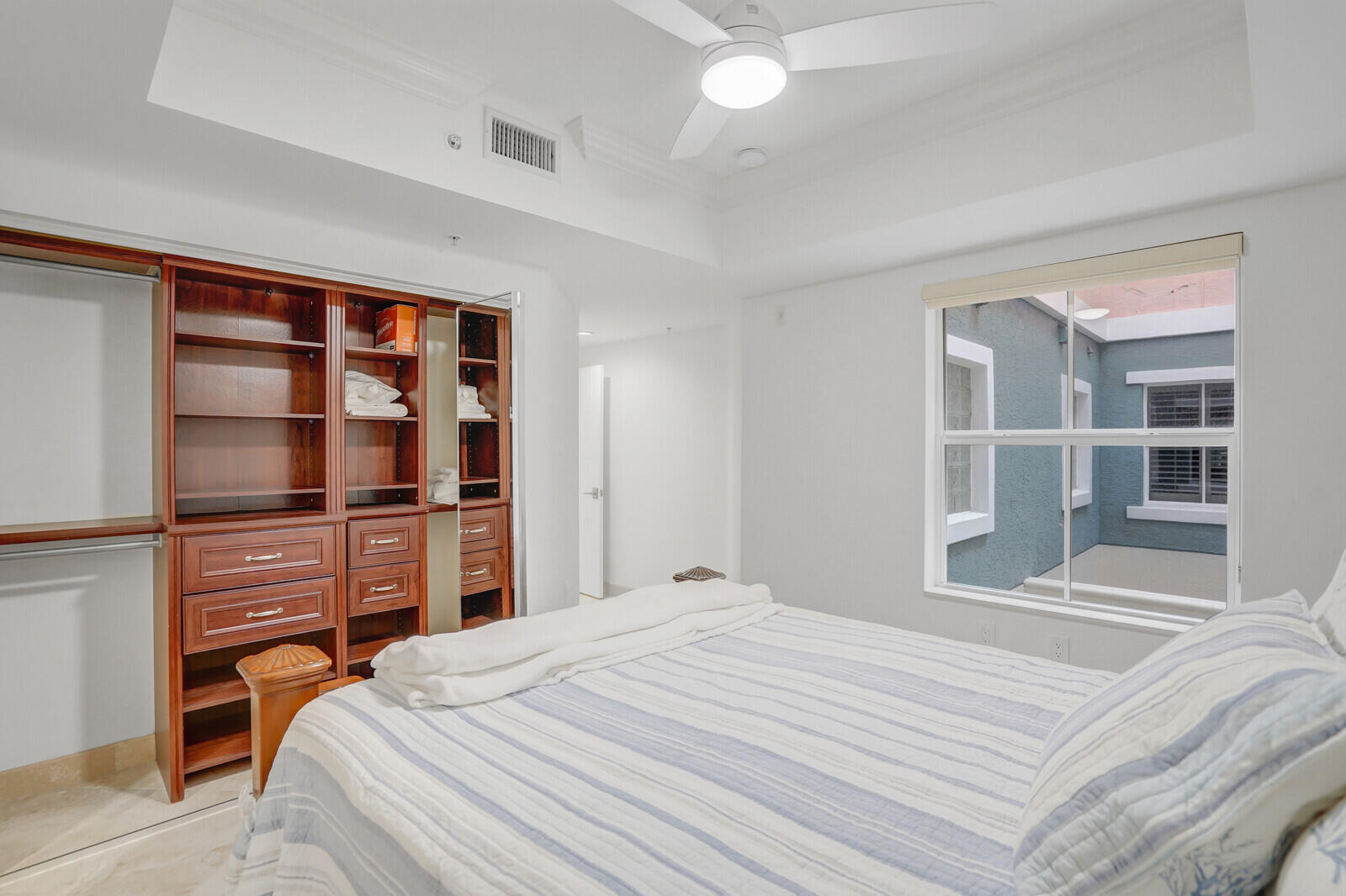 2051 Southeast 3rd Street, Unit TH7 Deerfield Beach, FL 33441 - Photo 34 of 48 a bedroom with a bed and closet