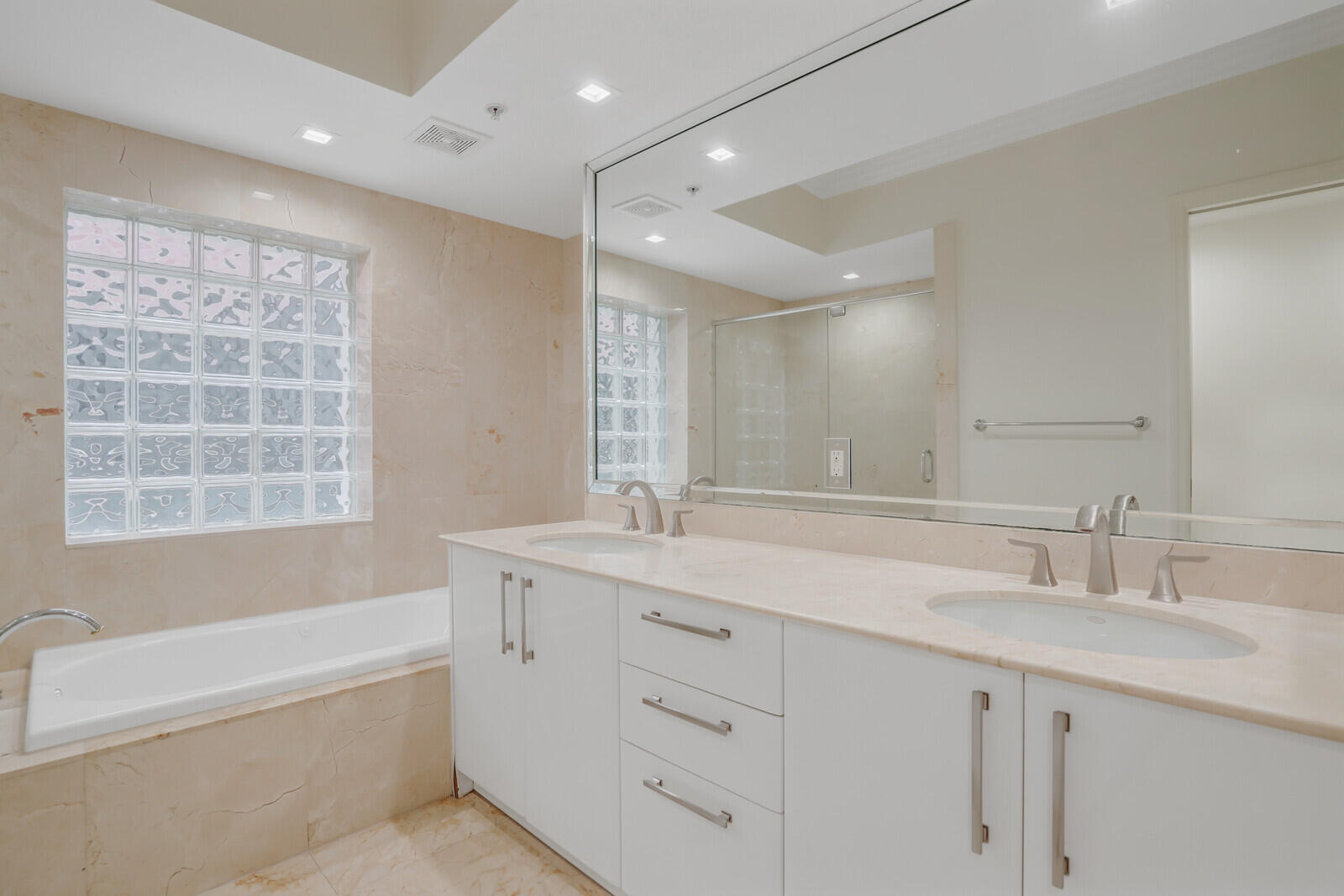 2051 Southeast 3rd Street, Unit TH7 Deerfield Beach, FL 33441 - Photo 36 of 48 a bathroom with a sink double vanity granite tub shower and a mirror