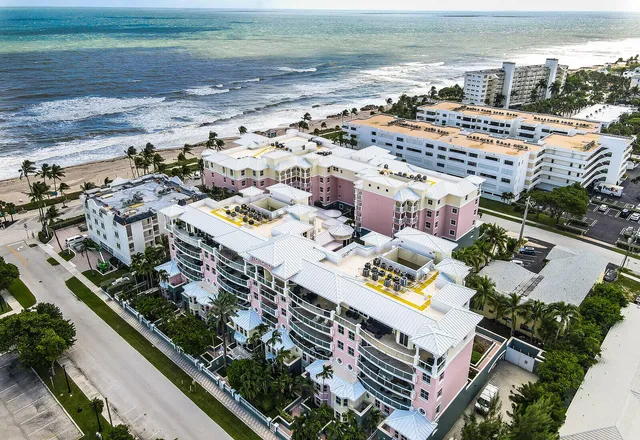 an aerial view of residential houses with outdoor space