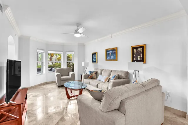 a living room with furniture and a lamp