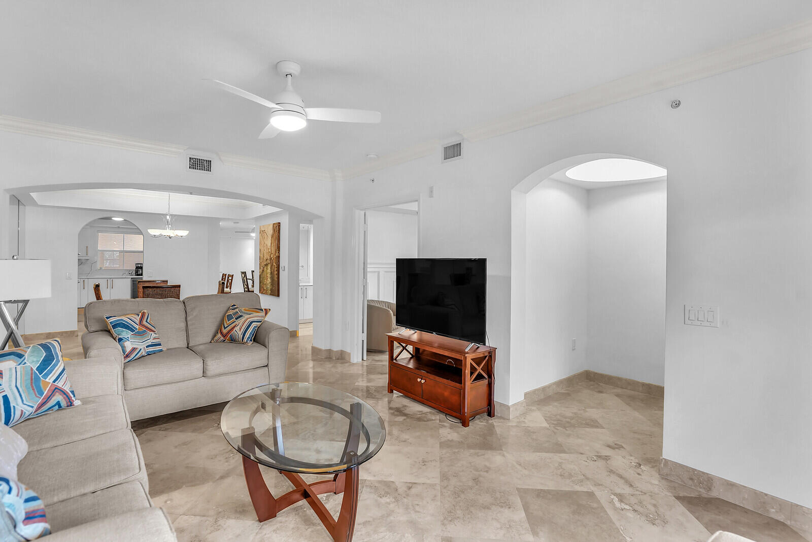 2051 Southeast 3rd Street, Unit TH7 Deerfield Beach, FL 33441 - Photo 10 of 48 a living room with furniture and a flat screen tv