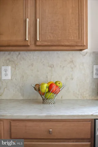 a living room with fireplace furniture and a wooden floor