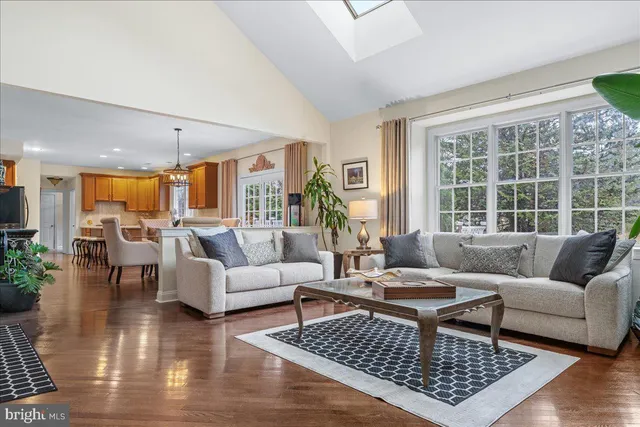 a view of a dining room with furniture and a chandelier